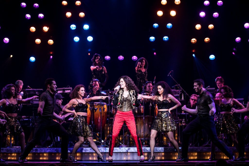 Christie Prades as Gloria Estefan and the company of the Broadway On Tour presentation of ON YOUR FEET! Oct. 30 – Nov. 4, 2018 at the Sacramento Community Center Theater. Photo by Matthew Murphy.