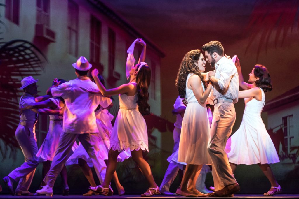 Christie Prades as Gloria Estefan, Mauricio Martinez as Emilio Estefan and the company of the Broadway On Tour presentation of ON YOUR FEET! Oct. 30 – Nov. 4, 2018 at the Sacramento Community Center Theater. Photo by Matthew Murphy.