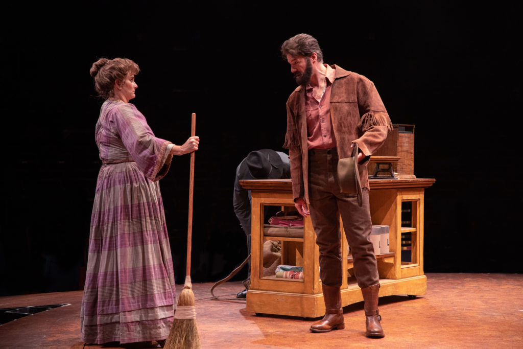 (from L to R) Diane Vincent as Mrs. Hoallum and Edward Watts as Adam Pontipee in SEVEN BRIDES FOR SE