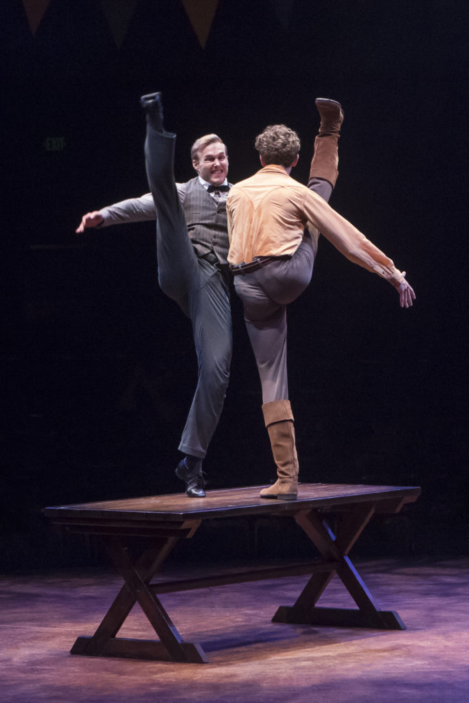 (from L to R) Cameron Edris as Jeb and Graham Keen as Caleb Pontipee in SEVEN BRIDES FOR SEVEN BROTH