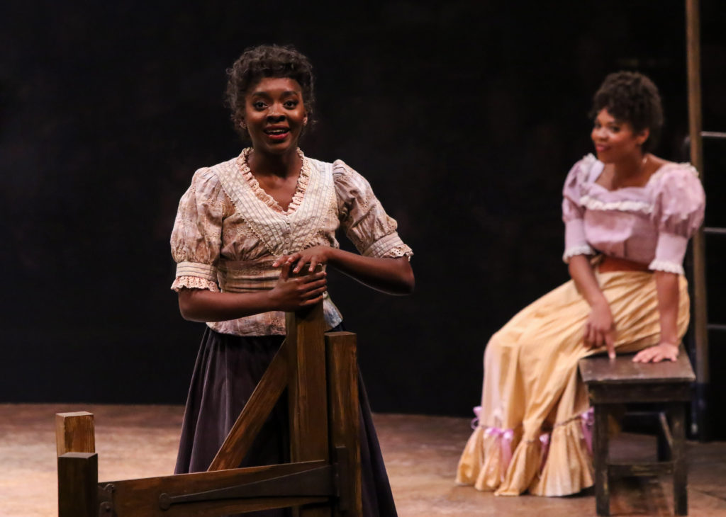 Emilie Kouatchou as Laurey Williams and Brit West as Ado Annie Carnes in OKLAHOMA! produced by Broadway At Music Circus at the Wells Fargo Pavilion June 25-30. Photo by Charr Crail.