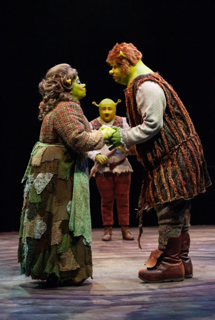 Jennifer Leigh Warren as Mama Ogre, Michael Stark as Young Shrek and Adam Rogers as Papa Ogre in SHREK THE MUSICAL produced by Broadway At Music Circus at the Wells Fargo Pavilion June 11-16. Photo by Charr Crail.