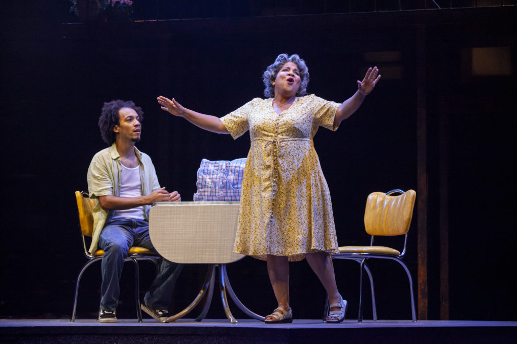 Rodolfo Soto as Usnavi and Rayanne Gonzales as Abuela Claudia in the Broadway At Music Circus production of IN THE HEIGHTS at the Wells Fargo Pavilion August 20-25. Photo by Charr Crail.