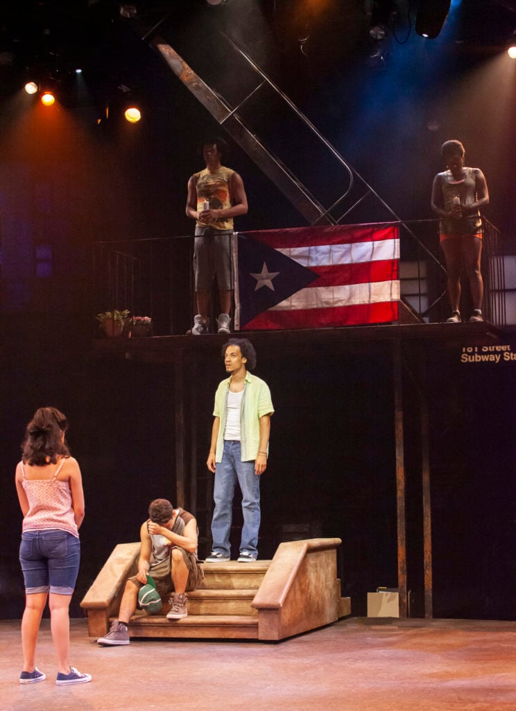 Didi Romero as Nina, David Merino as Sonny, Rodolfo Soto as Usnavi and the company of IN THE HEIGHTS produced by Broadway At Music Circus at the Wells Fargo Pavilion August 20-25. Photo by Charr Crail.