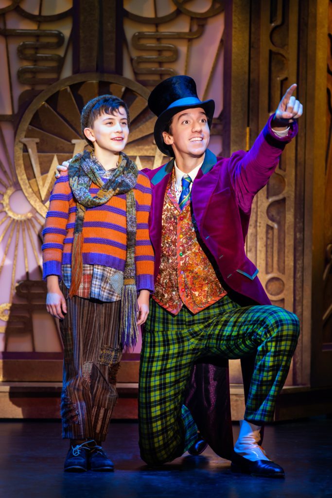Ryan Umbarila as Charlie Bucket and Cody Garcia as Willy Wonka in Roald Dahl’s CHARLIE AND THE CHOCOLATE FACTORY presented by Broadway On Tour December 28, 2021 – January 2, 2022 at the SAFE Credit Union Performing Arts Center. Photo by Jeremy Daniel.