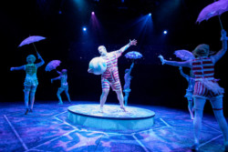 (Center) Aaron Kaburick as Uncle Fester and the company in the Broadway At Music Circus production of THE ADDAMS FAMILY at the UC Davis Health Pavilion July 25-30. Photo by Kevin Graft.